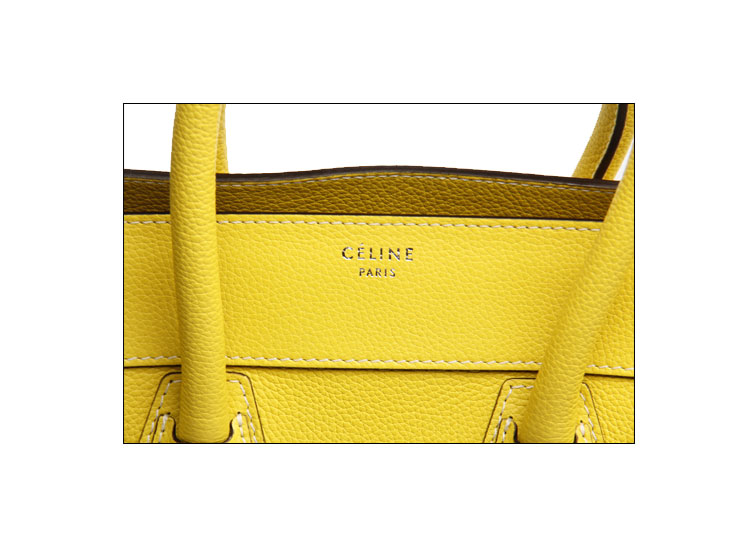 celine(赛琳)柠檬黄色皮质笑脸款手提包